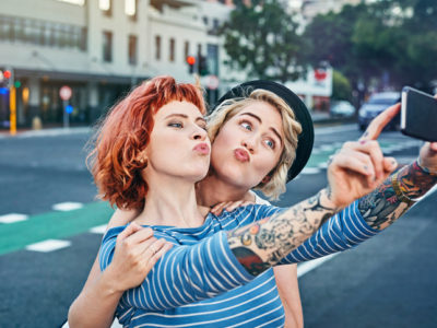 Two young women taking self portrait Two young women taking self portrait